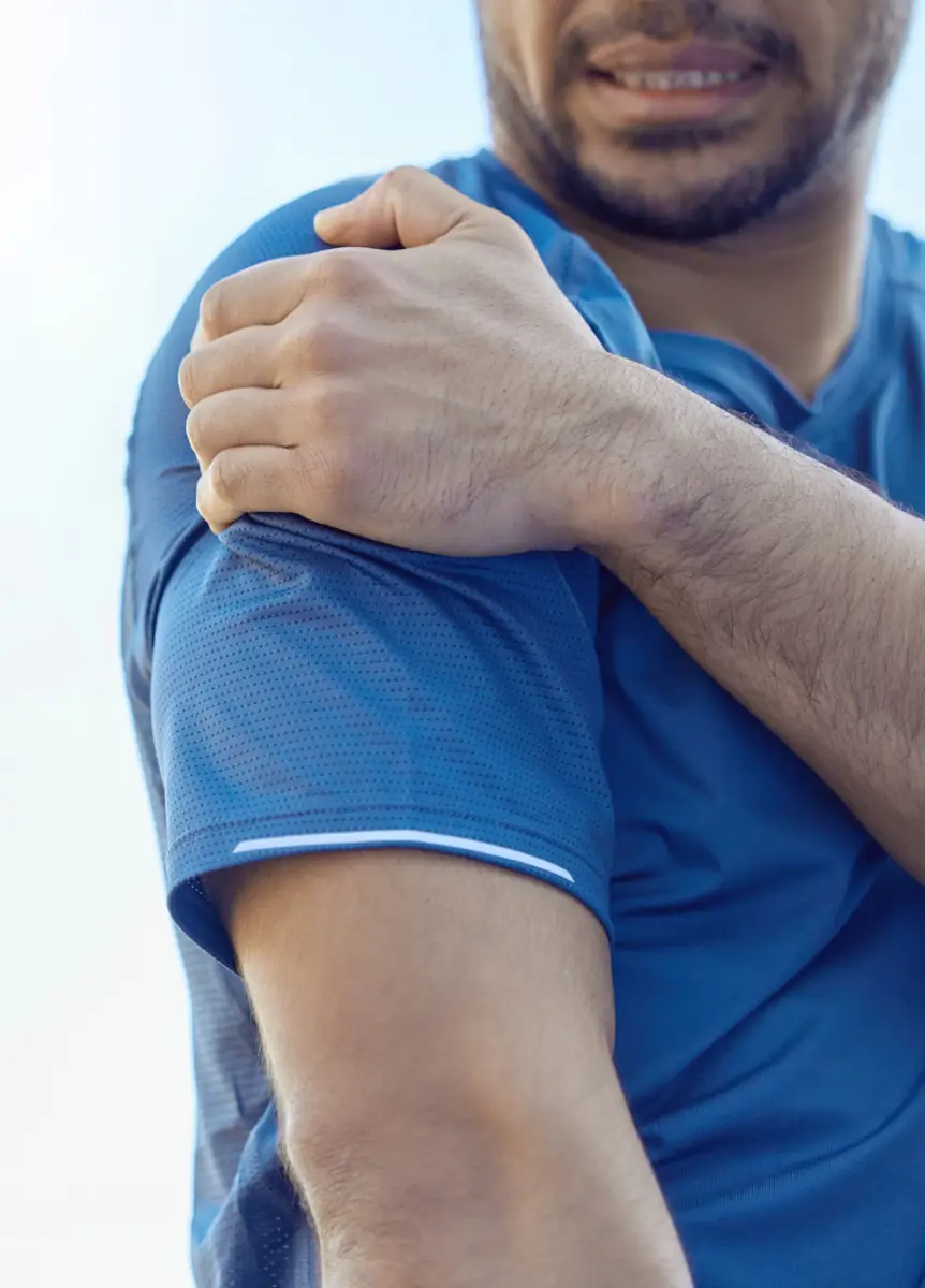 Person experiencing bursitis in shoulder Person experiencing bursitis in shoulder