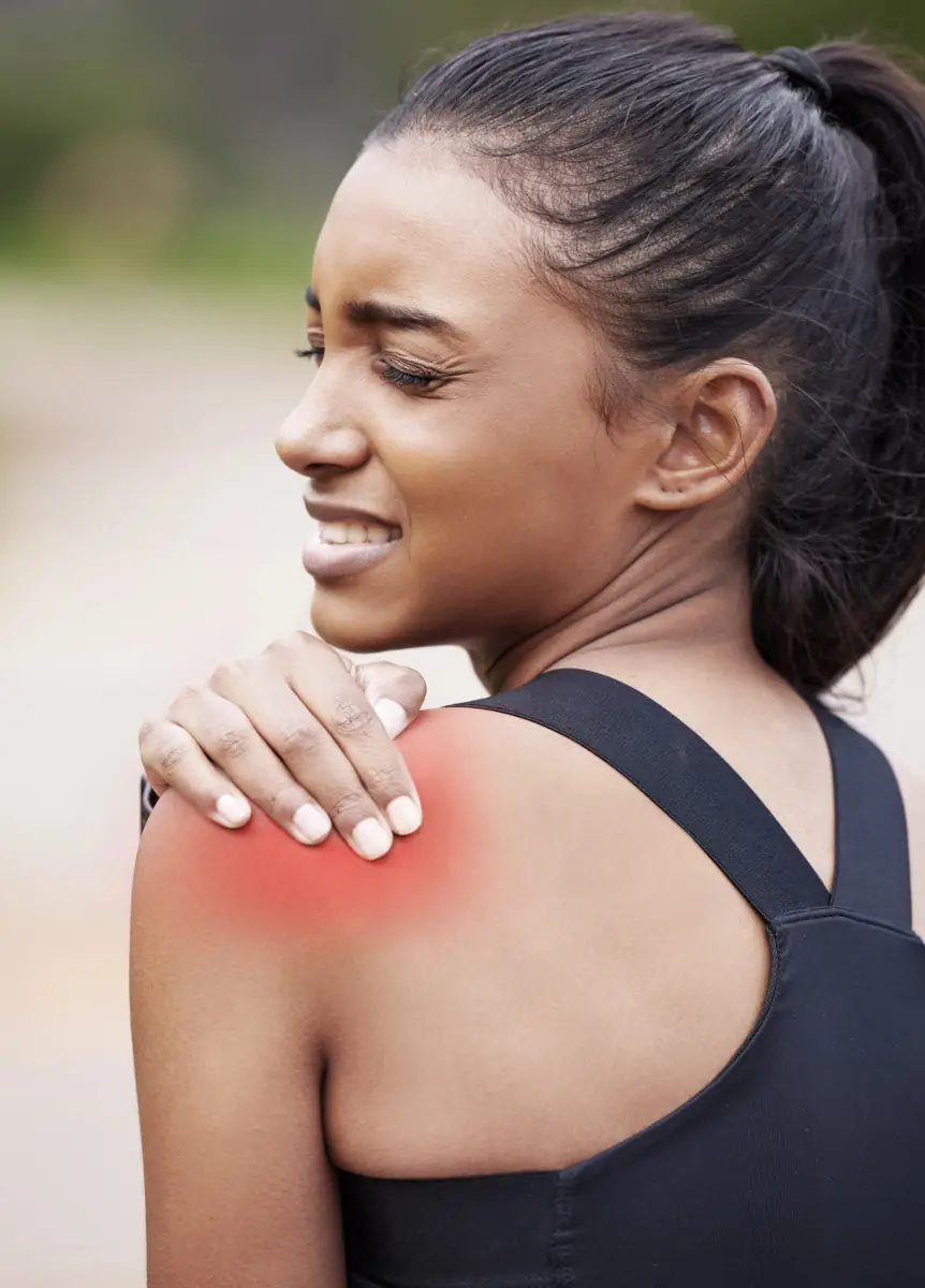 Person experiencing shoulder pain before treatment Person experiencing shoulder pain before treatment