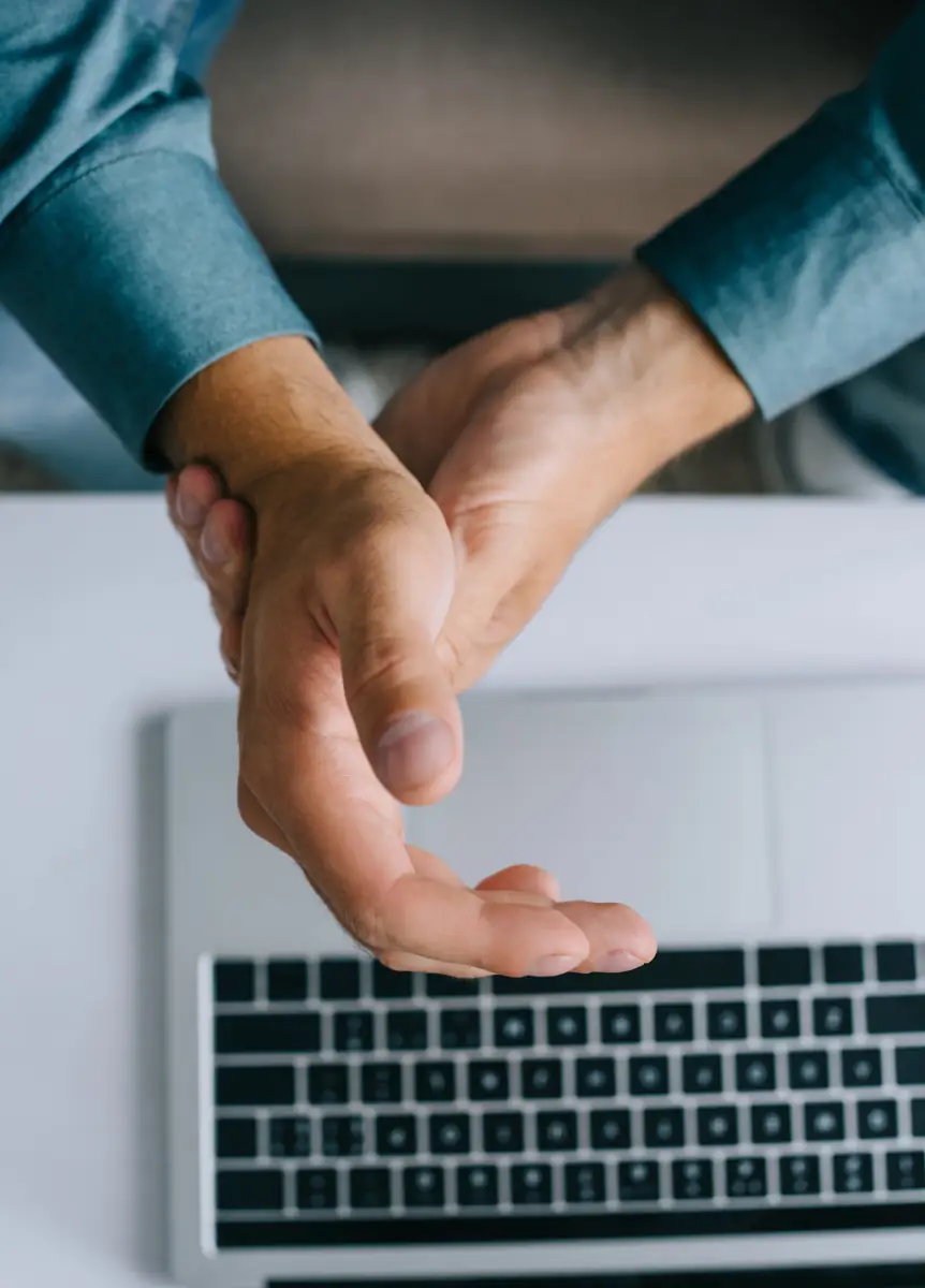 hand and wrist pain Person holding a painful hand and wrist